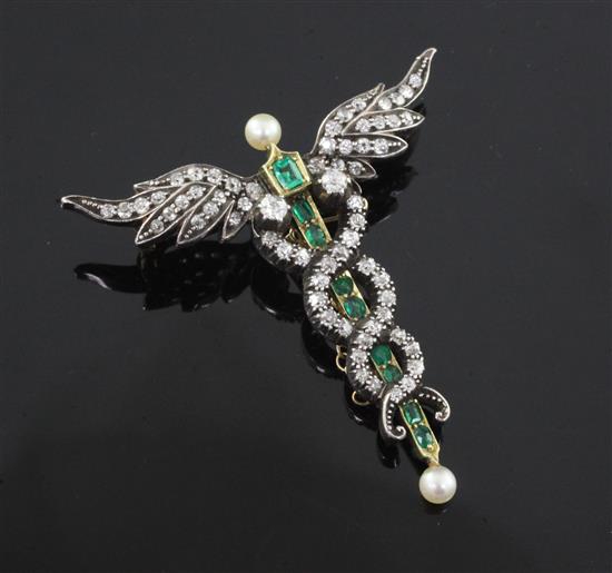 An Edwardian gold, emerald and diamond caduceus pendant brooch, with pearl-set terminals and safety chain, 45mm.